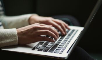 Typing on laptop