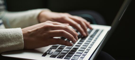 Typing on laptop
