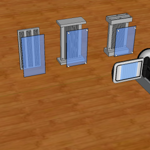 Four prototypes of the flytrack starting with a raceway approach and then leading to the final design with a sample video camera for recording.