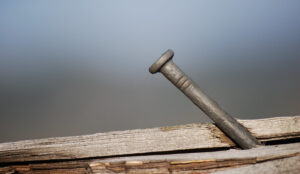 Nail in board