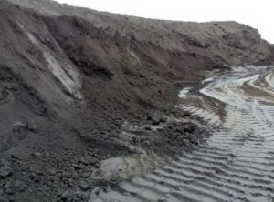 Mounds of coal ash at the Dominion power plant