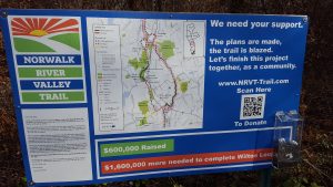 Signage along the trail urges residents to"finish this project together, as a community."