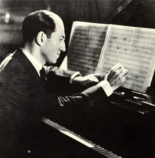 George Gershwin composing at the piano. American composer,