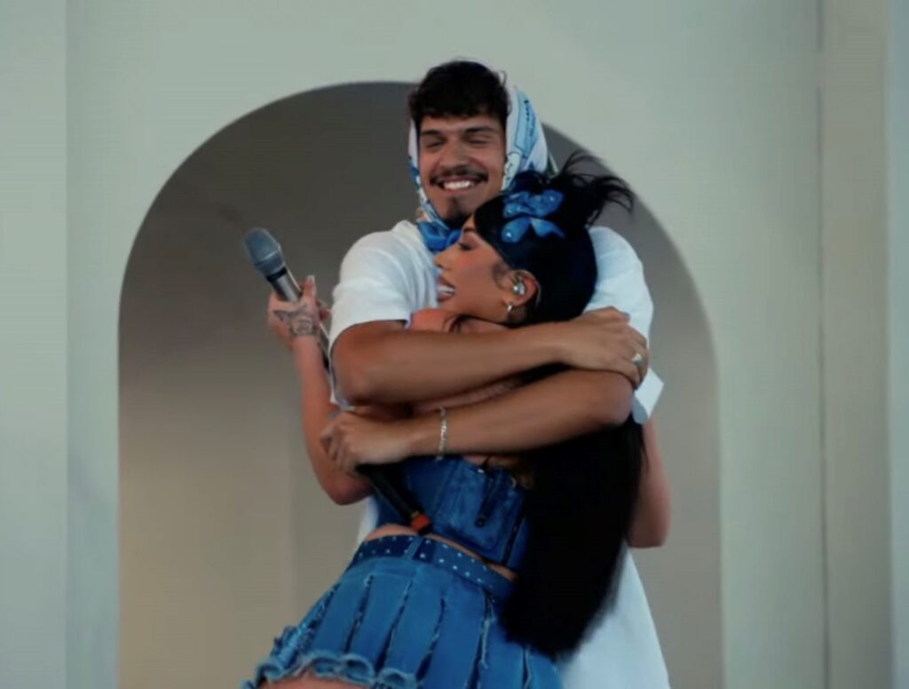 Kali Uchis and Omar Apollo embracing
